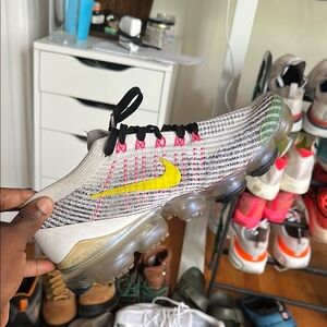 Nike Flyknit Sneakers with Yellow and Pink Accents